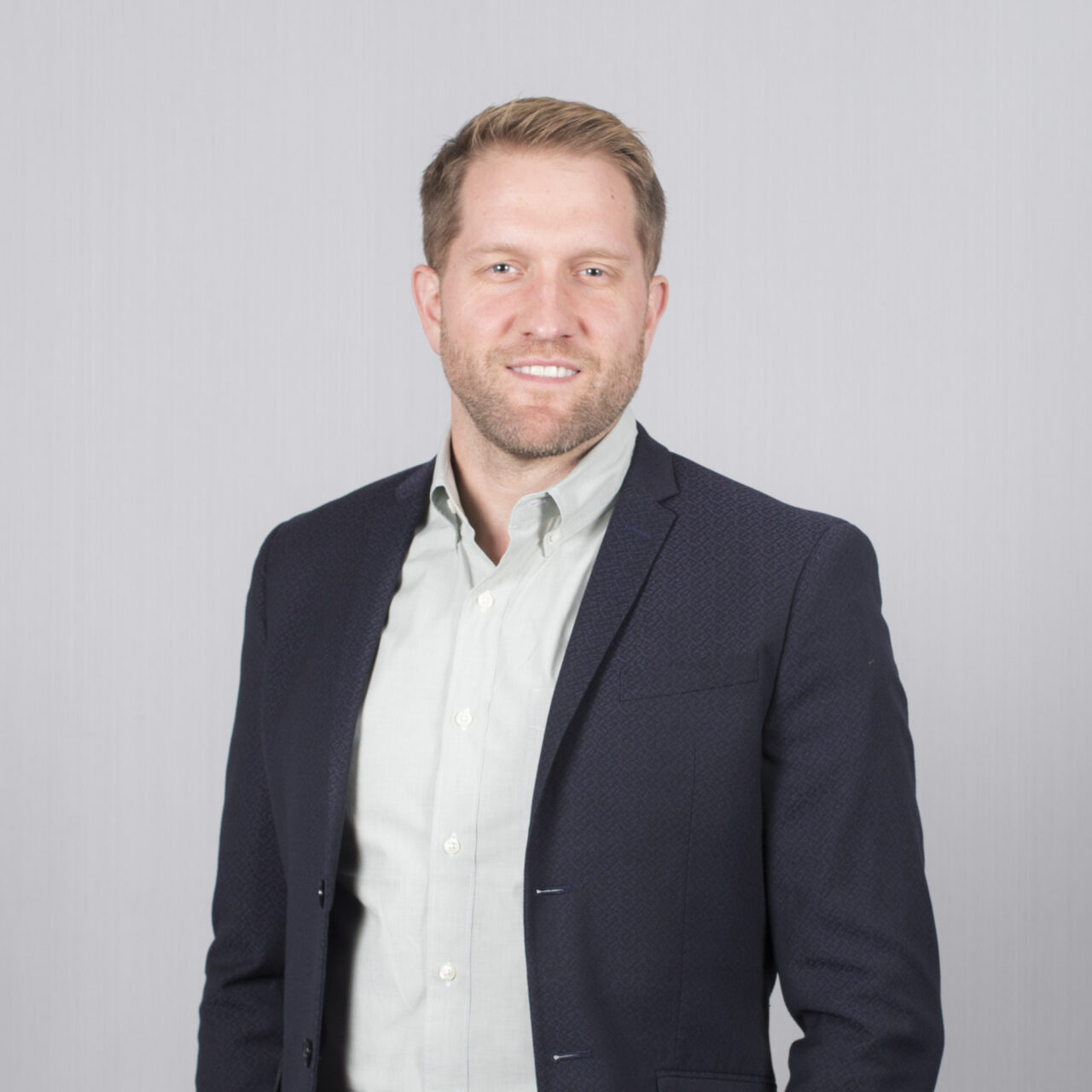 Headshot of Dr. Tom Benson - Chief Executive Officer and Director