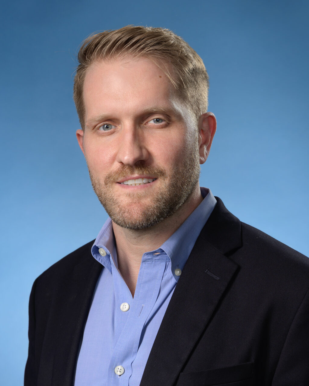 Headshot of Dr. Tom Benson - Chief Executive Officer and Director